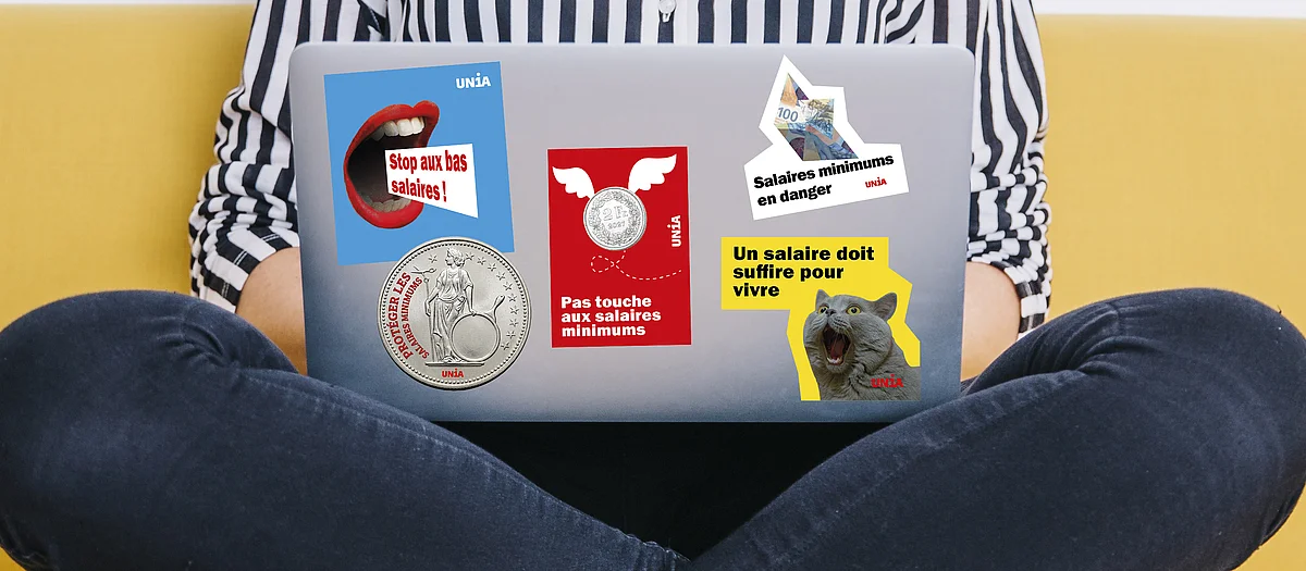 Couvercle d’ordinateur portable avec cinq autocollants Unia contre les bas salaires: «Stop aux bas salaires!», «Salaires minimums en danger», «Pas touche aux salaires minimums», «Protéger les salaires minimums» et «Un salaire doit suffire pour vivre».